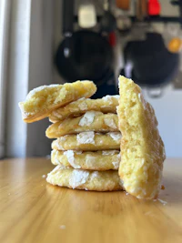 a stack of cookies with powdered sugar on top